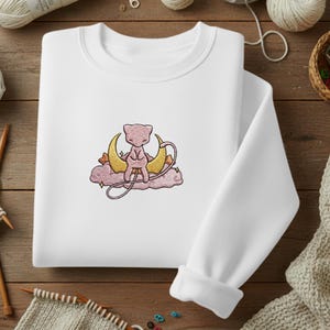 Könnte beinhalten: Ein Set aus drei Keramikbechern mit gesprenkelter, matter Oberfläche. Die Becher sind in den Farbtönen Creme, Hellgrau und Dunkelgrau gehalten. Jeder Becher hat ein schlichtes, minimalistisches Design, ideal für Kaffee oder Tee.