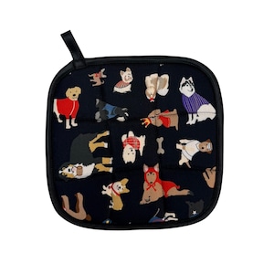 May include: Square navy blue pot holder with a black trim and a hanging loop. The pot holder features a repeating pattern of various dog breeds dressed in different outfits. The dogs are in various colors, including red, white, and brown.