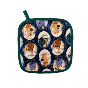 May include: Square quilted pot holder with a dark blue background and a repeating pattern of illustrated mice in suits. The mice are in oval frames with a white background. The pot holder has a green border and a green loop for hanging.