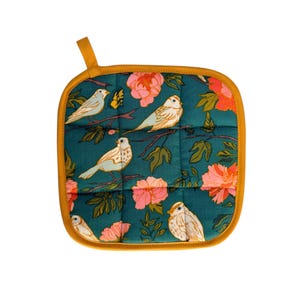 May include: Square teal pot holder with a floral and bird pattern. The design features light blue birds perched on branches with pink flowers and green leaves. The pot holder has a yellow border and a loop for hanging.