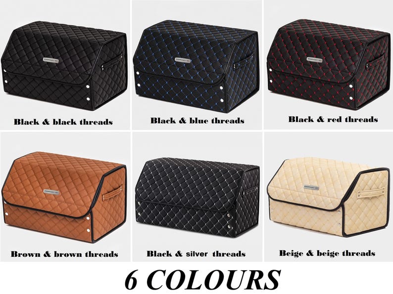 May include: Six different colored storage boxes with quilted fabric exteriors. The boxes are black with black, blue, red, brown, silver, and beige thread accents. The boxes are labeled with the color and thread color combination.