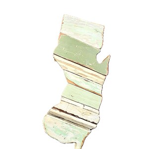 May include: A distressed wooden sign, inscribed with "Welcome to our home" in a handwritten font. The sign has a rustic finish, ideal for a front door or hallway, creating a welcoming atmosphere.