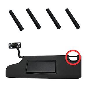 May include: Black sun visor with a built-in mirror and a small storage compartment. The visor has a black plastic frame and a black fabric covering. The mirror is rectangular and has a black plastic frame. The storage compartment is rectangular and has a black plastic lid. The visor is designed to be attached to a car's sun visor.