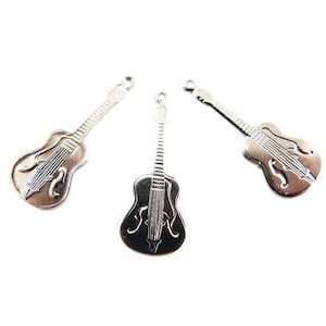 May include: Three silver guitar charms, each with a detailed outline of a guitar.