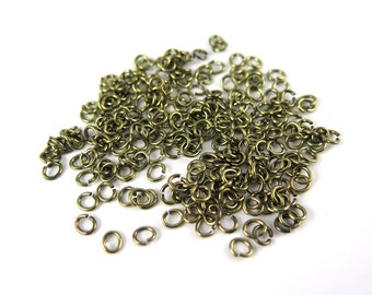 Antiqued Brass 4x5mm Oval Jump Rings - 12 grams (approximately 250x) (20 gauge) K858-E