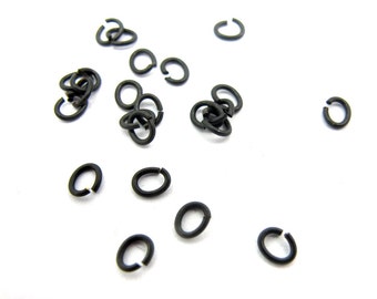 Dainy Matte Black Oval Jump Rings (10 grams - approximately 450x) (F586)