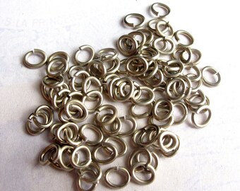 Rhodium Plated Oval Jump Rings 6mm x 5mm -  30 grams (approx 320x) (F553)