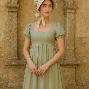 May include: A light green Regency-style dress with a square neckline and short, puffed sleeves. The dress features a gathered skirt and is paired with a matching bonnet with a ribbon tie. The background is a stone wall.