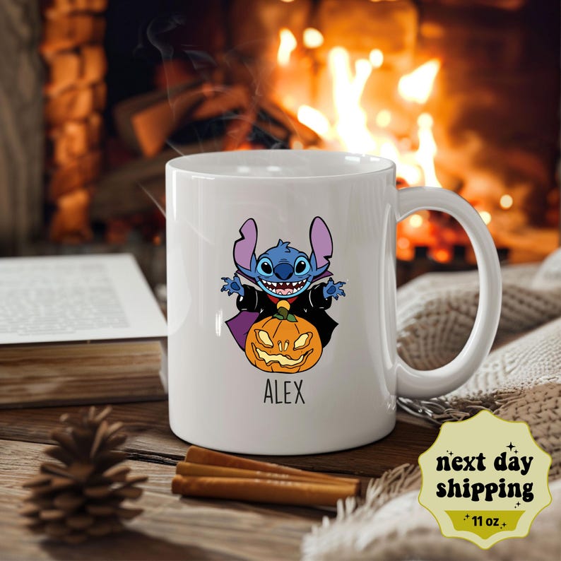 May include: White ceramic mug with a blue Stitch character dressed as a vampire holding a jack-o'-lantern. The mug has the name "Alex" printed on the bottom.