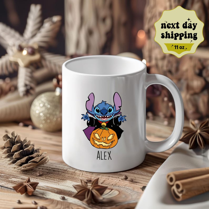 May include: White ceramic mug with a blue Stitch character dressed as a vampire holding a jack-o'-lantern. The mug has the name "ALEX" printed on the bottom.