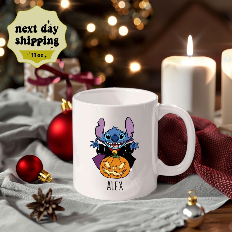 May include: White ceramic mug with a blue Stitch character dressed as a vampire holding a jack-o'-lantern. The mug has the name "ALEX" printed on the bottom.