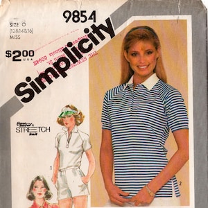 May include: Vintage Simplicity sewing pattern 9854 featuring three different polo shirt designs. The pattern includes sizes 12, 14, and 16. The image shows illustrations of the finished garments, including a striped polo shirt.