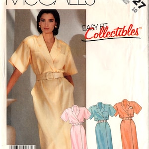 May include: McCall's sewing pattern featuring a woman in a yellow dress with a belt. The pattern includes illustrations of the dress in pink, blue, and orange. The text "Easy Fit Collectibles" is visible.