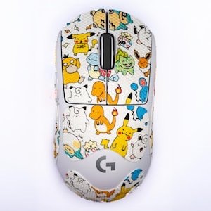 May include: A wireless computer mouse with a white and gray design, featuring a colorful pattern of cartoon characters. The mouse has a scroll wheel and the Logitech "G" logo.