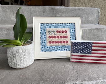 Patrón de punto de cruz de bandera floral en formato PDF para descargar.