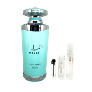 May include: A light blue glass bottle of Mayar perfume by Lattafa. The bottle has a silver cap and a silver band around the bottom. The bottle is labeled "Mayar" and "Natural Intense Lattafa". The image also shows three small perfume sample bottles.