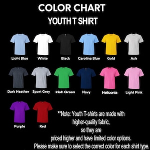 May include: A color chart for youth t-shirts displaying fourteen short-sleeve shirts in various colors including light blue, white, black, Carolina blue, gold, ash, dark heather, sport grey, Irish green, navy, heliconia, light pink, purple, and red.
