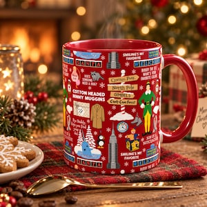 May include: A red ceramic mug featuring a repeating pattern of holiday-themed illustrations and text including 'Santa', 'Central Park', 'North Pole', 'Gimbels', 'Candy Cane Forest', 'Cotton Headed Ninny Muggins', and 'Smiling's My Favorite'.