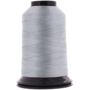 May include: A spool of light gray thread with a black plastic bobbin.