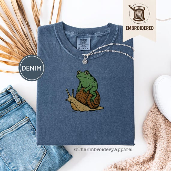 Embroidered Frog Riding Snail Shirt, Cute Cottagecore Animal Tee, Comfort Colors® Embroidery, Whimsical Nature Gift for Frog Lovers