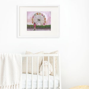 May include: A framed illustration of a girl standing in front of a large Ferris wheel with a pink sky in the background.