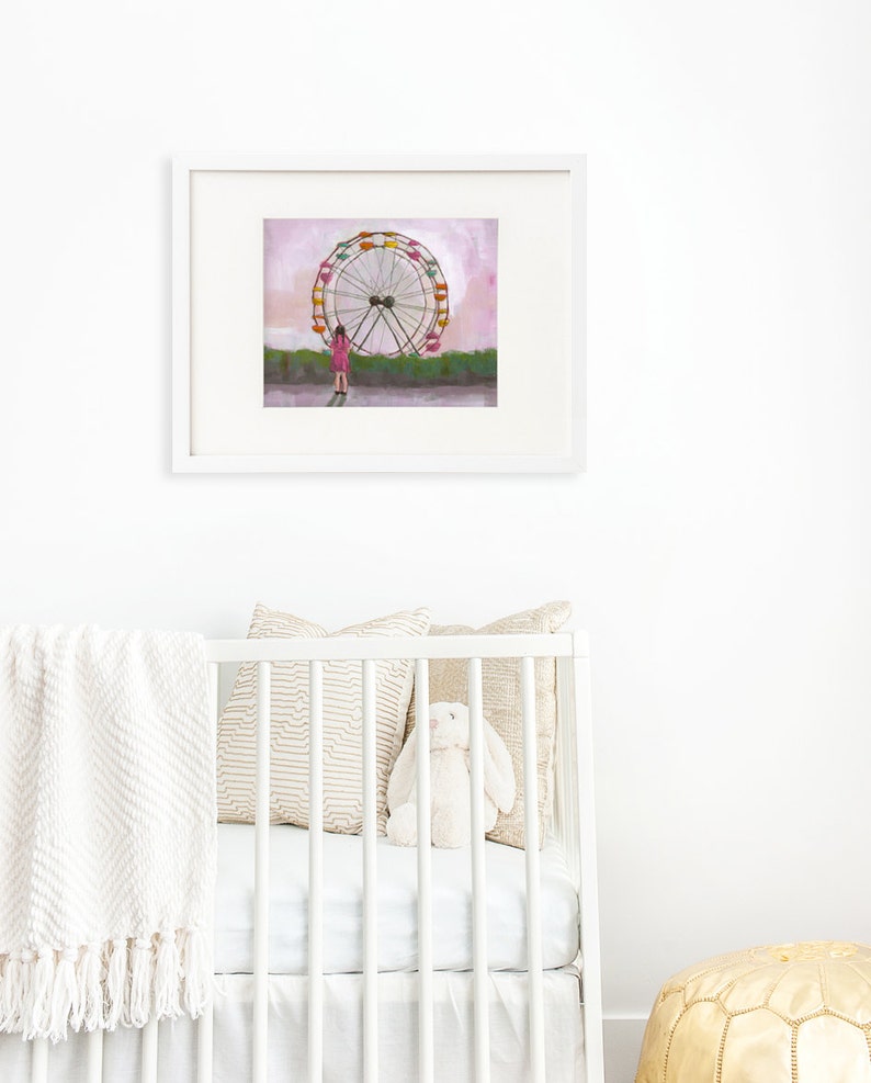 May include: A framed illustration of a girl standing in front of a large Ferris wheel with a pink sky in the background.