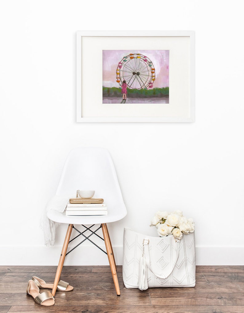 May include: A framed illustration of a girl standing in front of a large Ferris wheel with a pink sky in the background.
