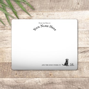 May include: White card with black text that reads "From the desk of YOUR NAME HERE and the dogs under it."  A black and white illustration of a dog and a smaller dog sitting below the text.