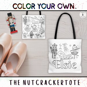 May include: A white tote bag with black outlines of a Nutcracker, a ballerina, and a sleigh. The bag has the text "Elsie" on it and the words "The Nutcracker Tote" are printed below the bag.