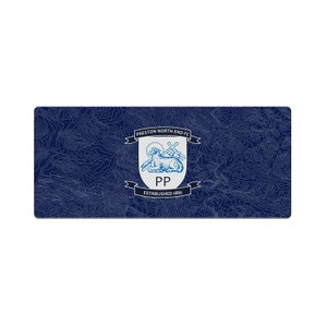 May include: A blue and white crest with a lamb, a cross, and the text "Preston North End FC Established 1880" on a dark blue background with a topographic pattern.
