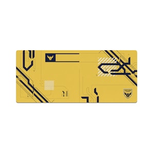May include: Yellow and black geometric design mouse mat with the Oxford United logo in the bottom right corner.