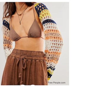 Free People Gia Shrug - make your own with this crochet pattern. This shrug / bolero pattern is for beginners and can be made in a weekend. This shrug / bolero is great for the spring or as a beach shrug during the summer.