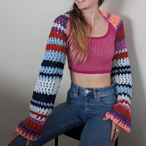 Free People Gia Shrug - make your own with this crochet pattern. This shrug / bolero pattern is for beginners and can be made in a weekend. This shrug / bolero is great for the spring or as a beach shrug during the summer.