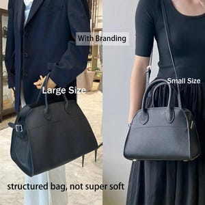 May include: Two black structured handbags, one large and one small, are displayed. The large bag has a rectangular shape with a top handle and a shoulder strap. The small bag is a rounded shape with a top handle and a shoulder strap. Text on the image reads "With Branding", "Large Size", "Small Size", and "structured bag, not super soft".