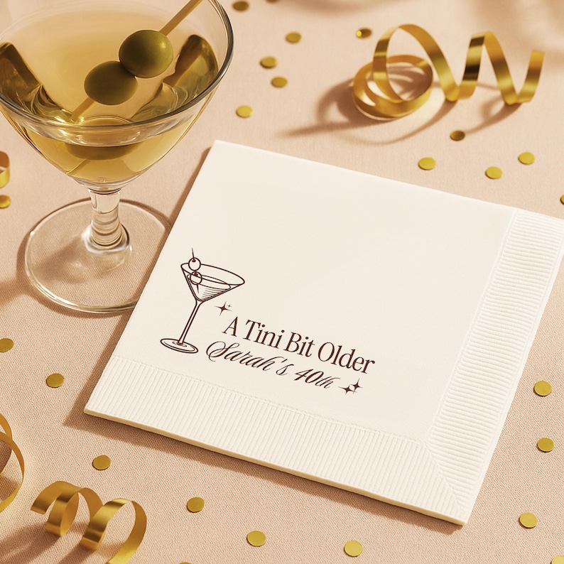 Celebrate in style with personalized 40th birthday napkins featuring A Tini Bit Older martini glass illustration. Custom printed with your name and milestone age on high quality white napkins, sold in sets of 50. Perfect for cocktail parties, martini themed birthdays, and chic events.