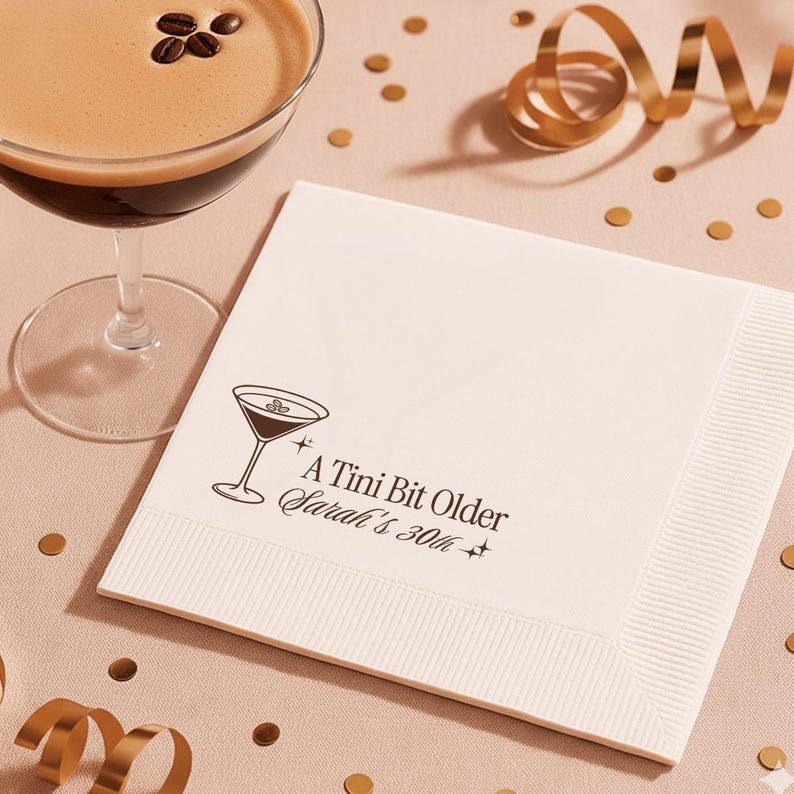 Elegant custom cocktail napkin for 30th birthday with espresso martini theme. A Tini Bit Older wording with personalized name and milestone age printed in chic minimal style. Ideal for modern milestone parties, upscale gatherings, and personalized event décor.