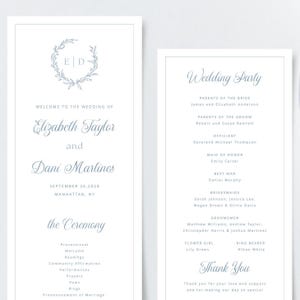 May include: Wedding ceremony program with a light blue floral wreath and the couple's names, Elizabeth Taylor and Dani Martines, printed in a script font. The program lists the wedding party, officiant, and ceremony order.