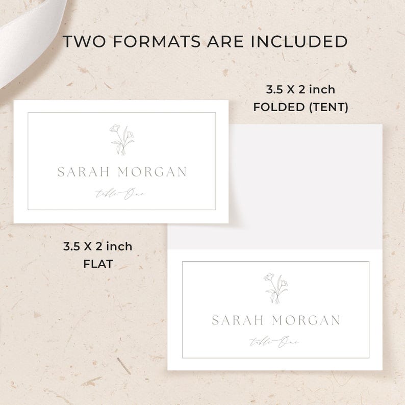 May include: Two white rectangular place cards featuring a thin border, a small line-art floral illustration, and the printed text Sarah Morgan and Table One. One card is flat, and the other is folded into a tent shape, both measuring 3.5 x 2 inches.