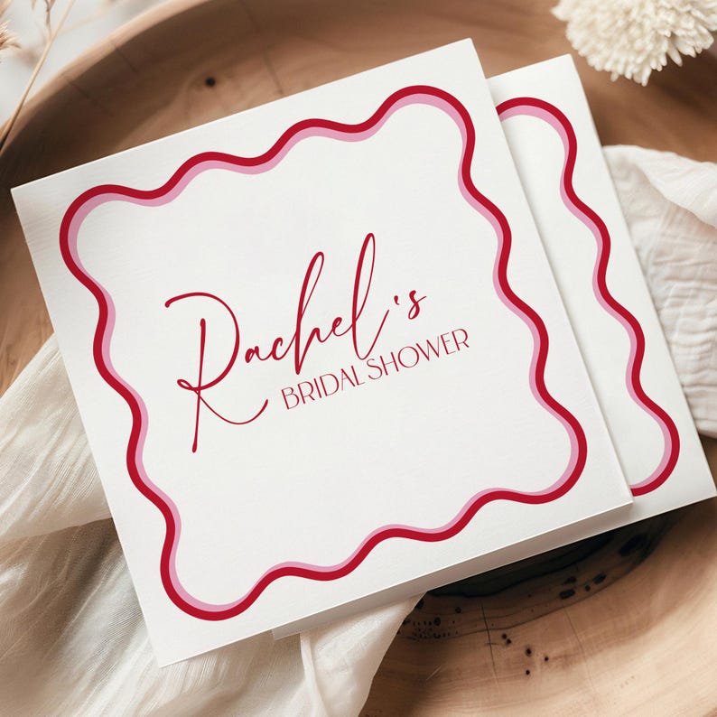 Personalized wedding shower napkins with chic red wavy border and modern script. White cocktail napkins designed for bridal showers, rehearsal dinners, or engagement parties, bringing elegance and personalization to every celebration.