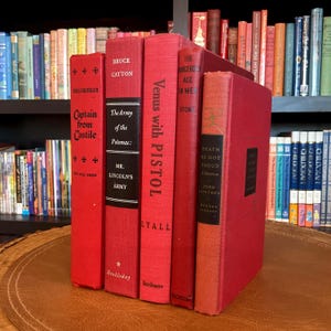 Red and black vintage book stack