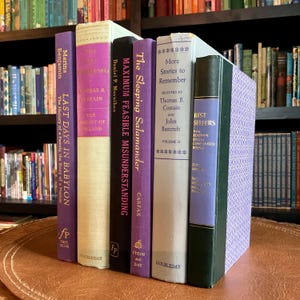 Purple, black, and gray mid century modern book stack