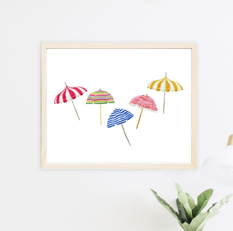 May include: A watercolor painting of five colorful striped beach umbrellas. The umbrellas are yellow, red, blue, green, and pink.