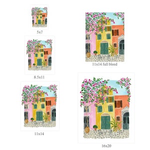 May include: A collection of five art prints featuring a Mediterranean street scene with pink bougainvillea, yellow, pink, and orange buildings, green doors, and a cobblestone path. The prints are labeled 5x7, 8.5x11, 11x14 full bleed, 11x14, and 16x20 inches.