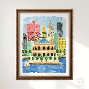 May include: A framed watercolor painting of a city skyline featuring a prominent domed building in the foreground, a red ferris wheel, and various skyscrapers in shades of red, yellow, and grey, all set against a blue sky above a blue body of water.