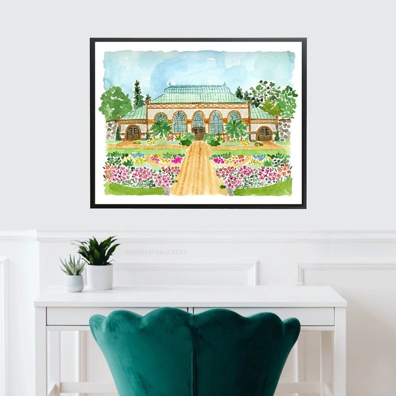 May include: Watercolour painting of a greenhouse with a green roof and brown brick walls. The greenhouse is surrounded by a garden with colourful flowers and a path leading to the entrance.