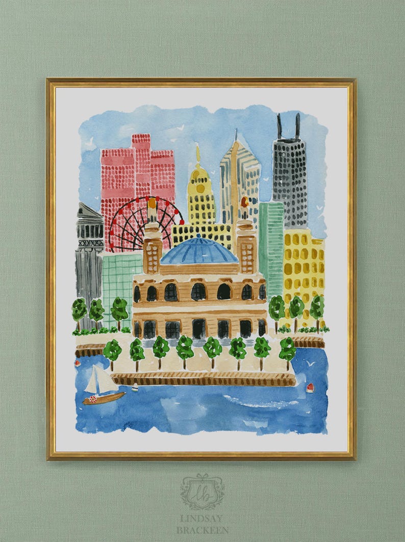 May include: A framed watercolor painting of a city skyline featuring a large domed building in the foreground, a red ferris wheel, and various skyscrapers. A small sailboat floats on blue water in the lower section. The artist name Lindsay Brackeen is printed at the bottom.