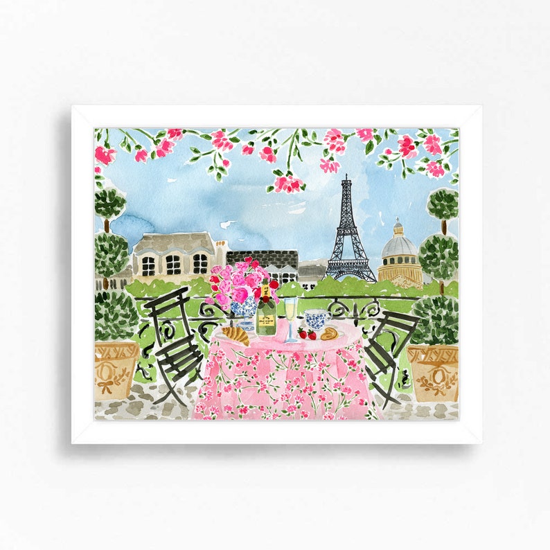 May include: A watercolor painting of a Parisian balcony scene with a pink tablecloth, two chairs, a bottle of champagne, and a glass of champagne. The Eiffel Tower is visible in the background.