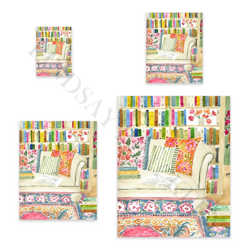 May include: Watercolour print depicting a cosy reading nook with a white sofa, colourful cushions, and a bookshelf filled with books. A patterned rug and open book enhance the inviting feel. Available in various sizes.