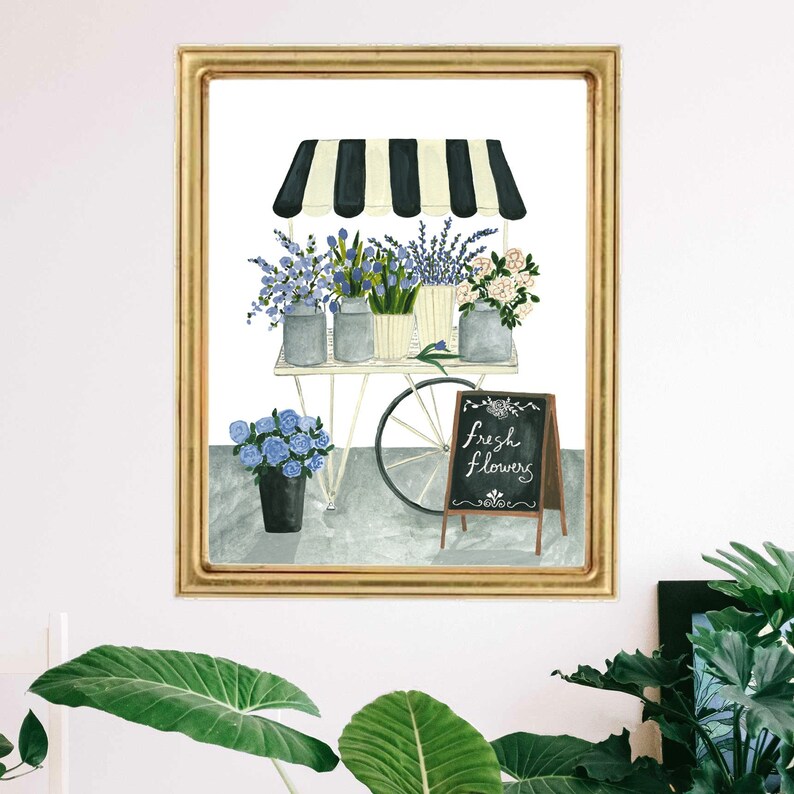 May include: A watercolor illustration of a flower cart with a striped awning. The cart is filled with blue and white flowers and has a sign that says "fresh flowers".