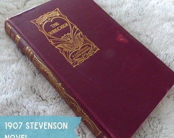 1907 Stevenson novel with red and golden impressions cover